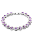 Bracelet with purple gemstones on a white background