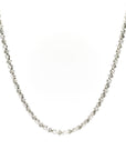 Silver necklace with small beads on a white background