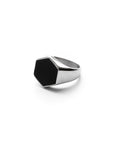 Silver ring with a black gemstone on a white background